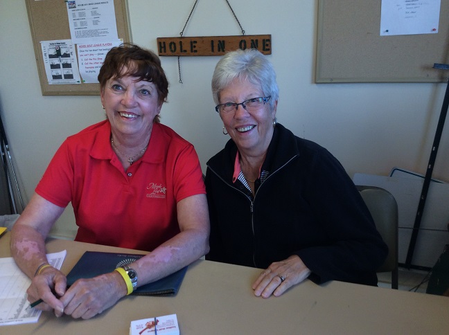 Barb Peterson and Betty Alexander sell luncheon tickets